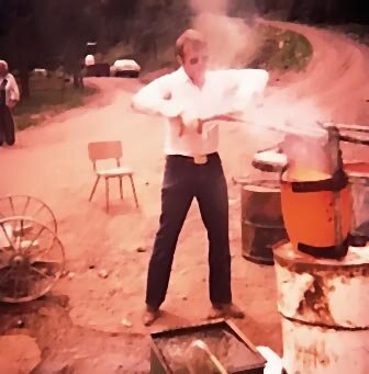 TD Barnes, president Geneva Minerals Inc. pouring gold at company's placer mine in Placerville,Colorado